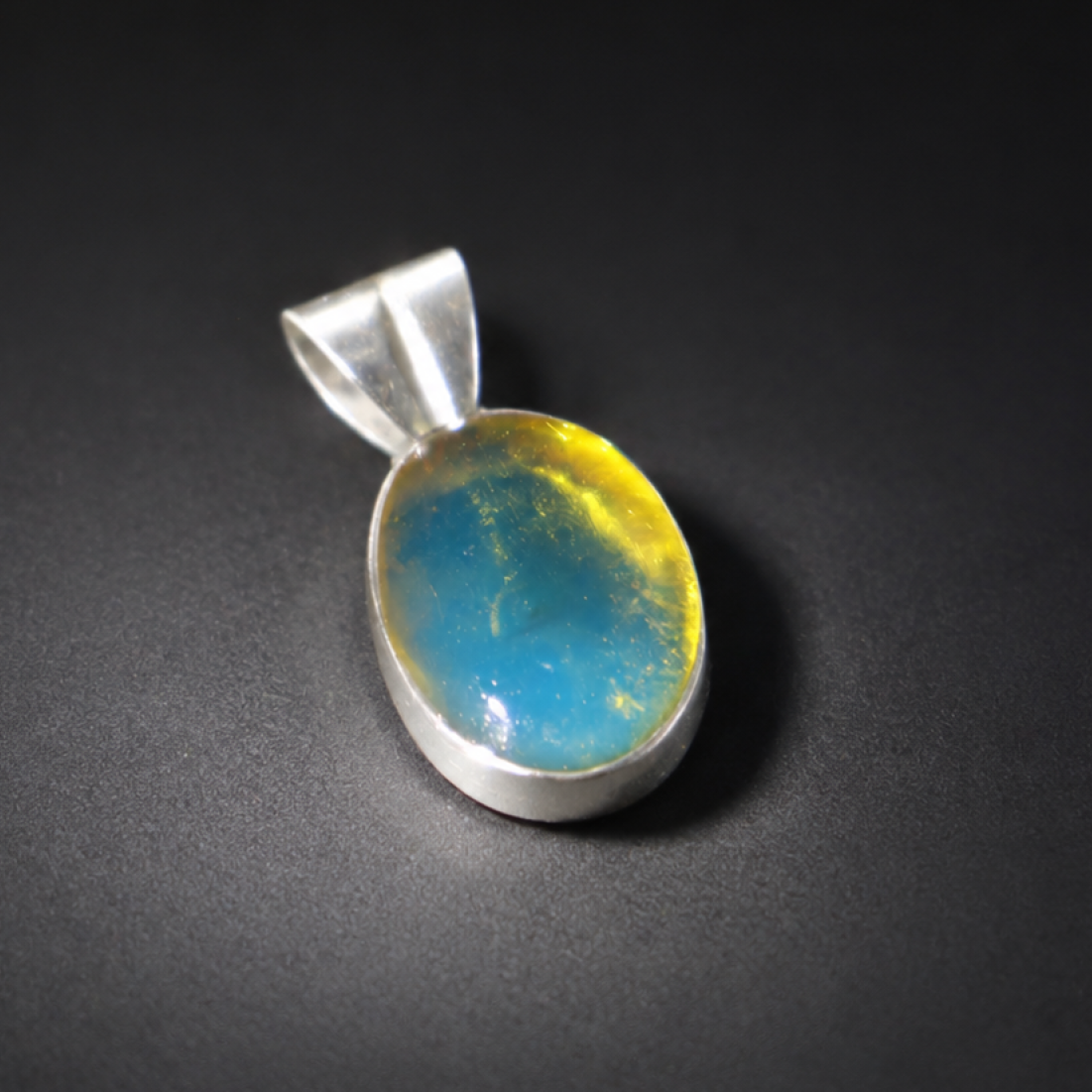 Clear deep blue Natural Dominican Amber oval 925 Sterling Silver Pendant 25 mm