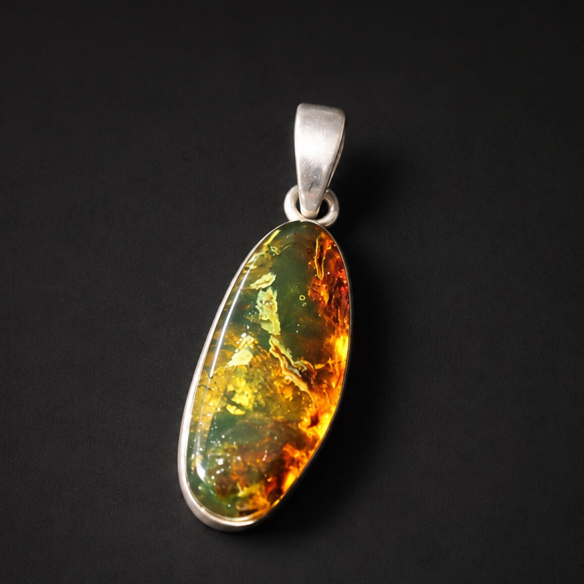 Handcrafted orange green Dominican amber sterling silver pendant 31mm