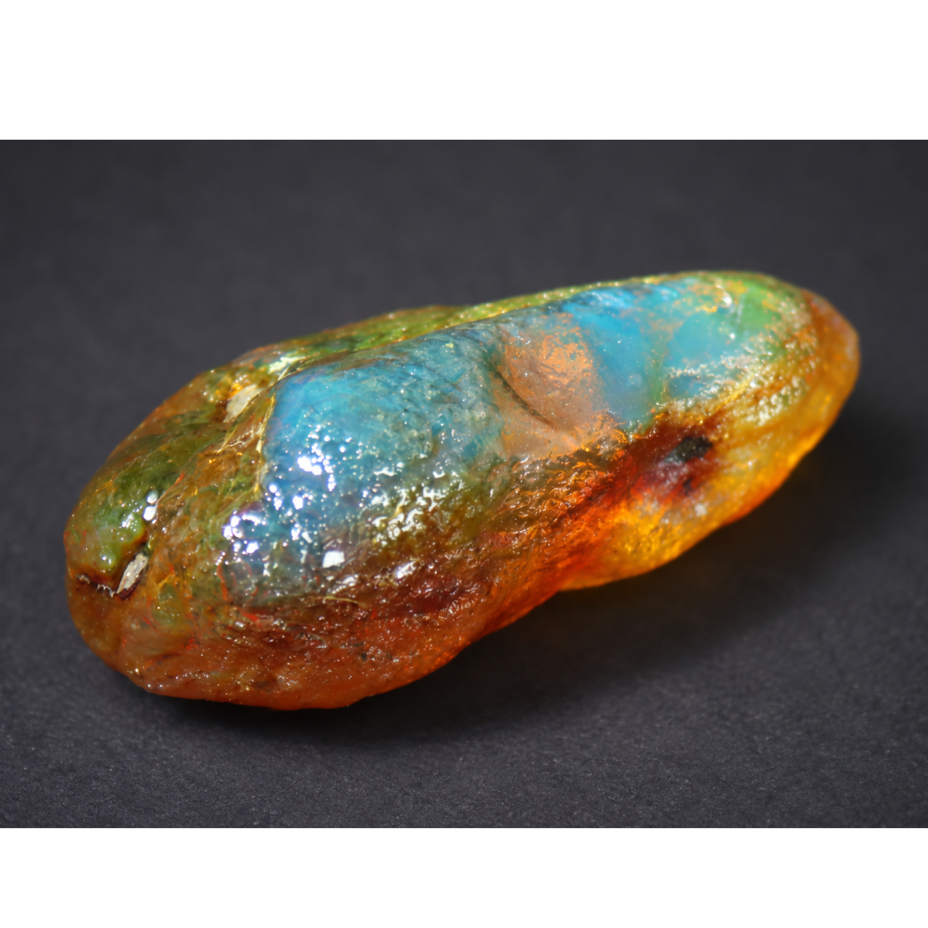 Genuine orange blue rough specimen Dominican amber 53mm
