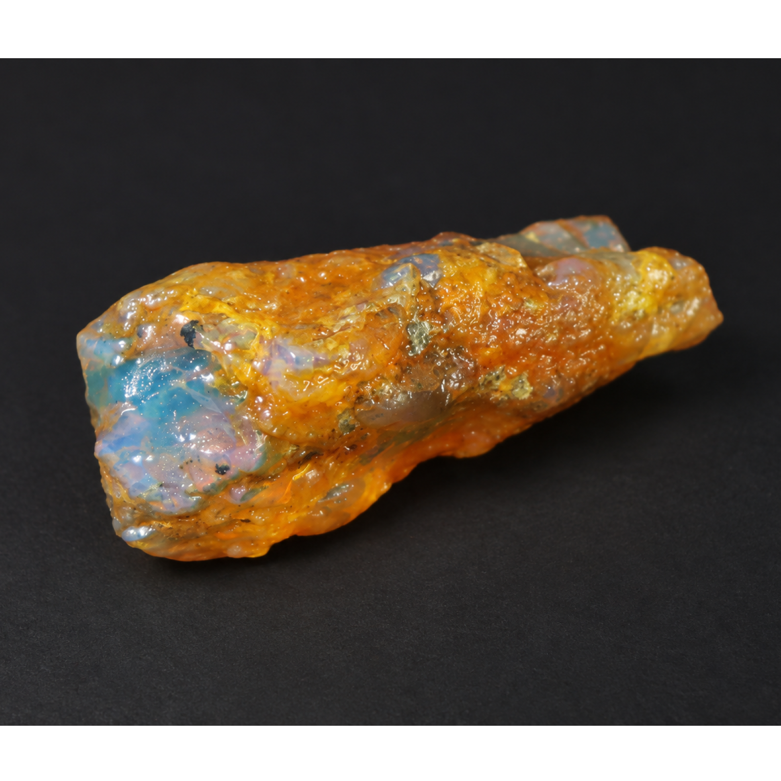 Genuine orange blue rough specimen Dominican amber 43mm
