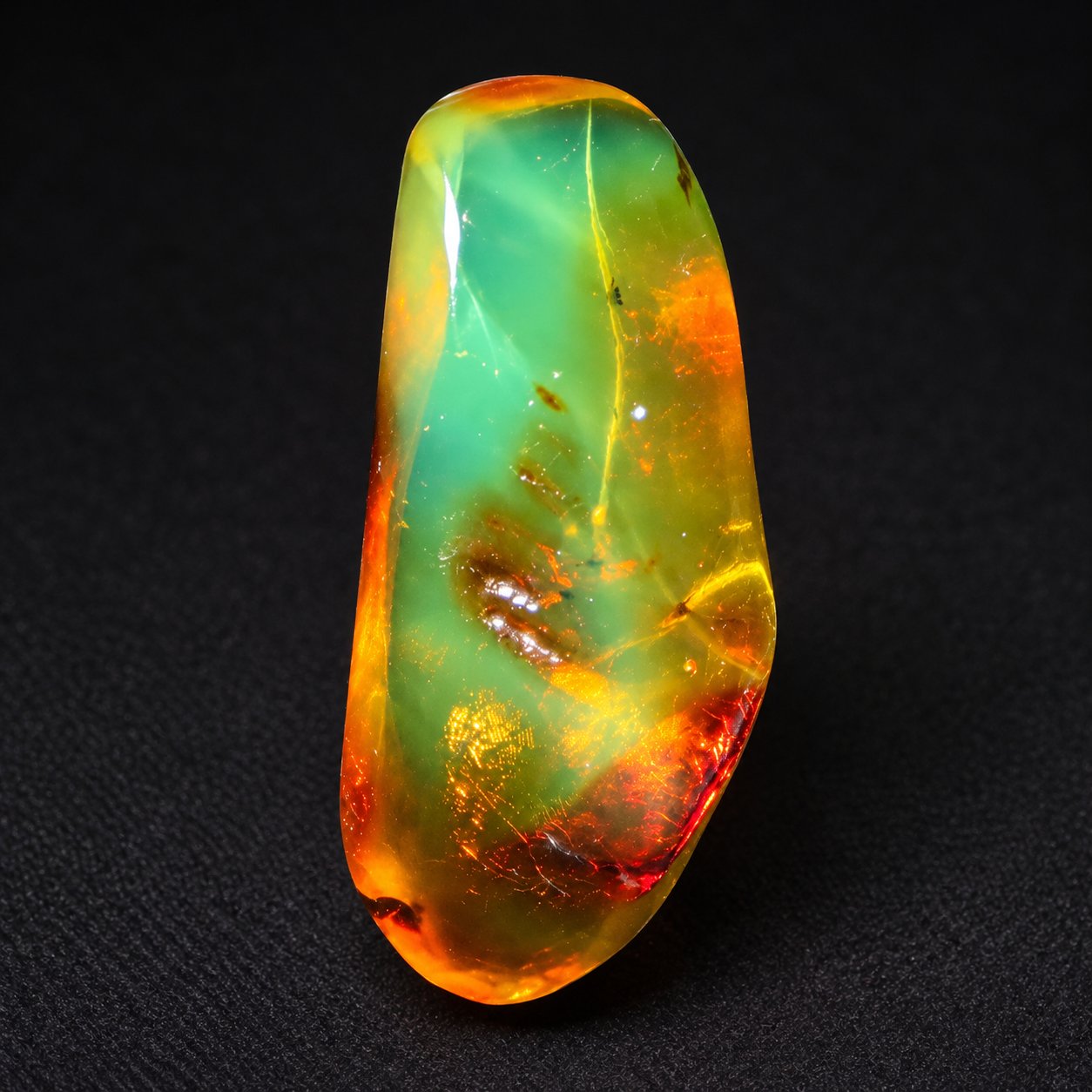 Real dark green polished Dominican amber 35mm